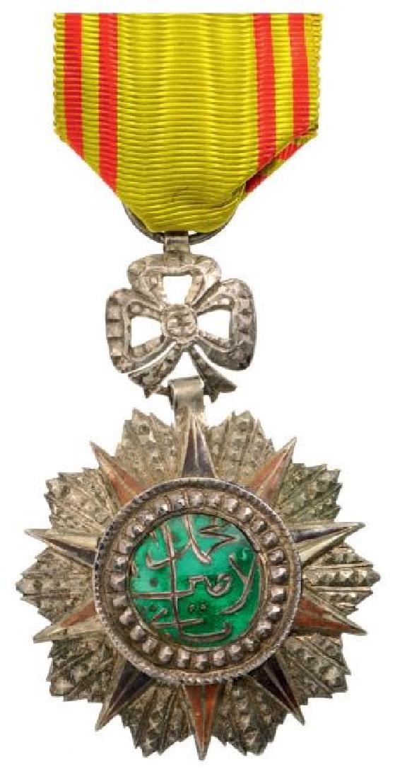 ORDER OF NICHAN AL IFTIKHAR: TUNISIA, Officer`s Cross, 4th Class, Mohamed es Sadok Bey (1859 - 1882). Breast Badge, 50 mm, Silver with brilliant cut rays, enameled, central medallion silver, enameled, original ornamented suspensi