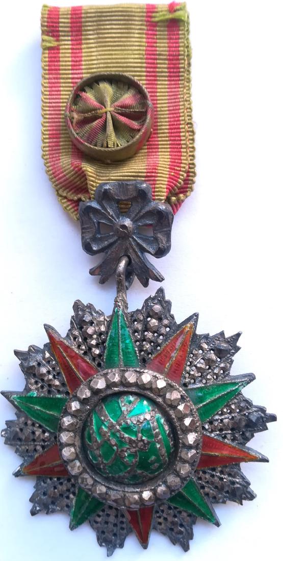 ORDER OF NICHAN AL IFTIKHAR: TUNISIA, Officer`s Cross, 4th Class, Mohamed es Sadok Bey (1859 - 1882). Breast Badge, silver with brilliant cut rays, 50 mm, enameled, central medallion silver, enameled, original ornamented suspensi