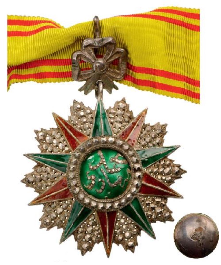 ORDER OF NICHAN AL IFTIKHAR: TUNISIA, Commander`s Cross, 3rd Class, Mohamed el Nacer (1906 - 1922). Neck Badge, silver with brilliant cut rays, 60 mm, partially repierced, enameled, central medallion silver, enameled, original or
