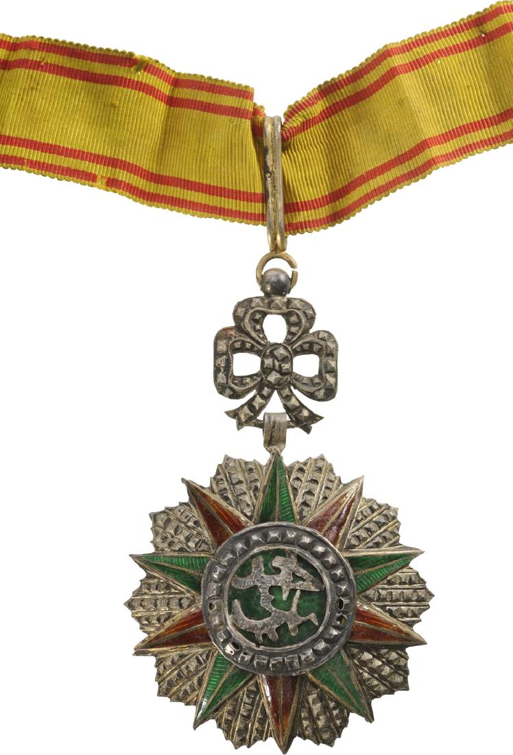 ORDER OF NICHAN AL IFTIKHAR: TUNISIA, Commander`s Cross, 3rd Class, Sidi Ahmed (1929 - 1942). Neck Badge, silver with brilliant cut rays, 58 mm, enameled, central medallion silver, enameled, original ornamented suspension device 