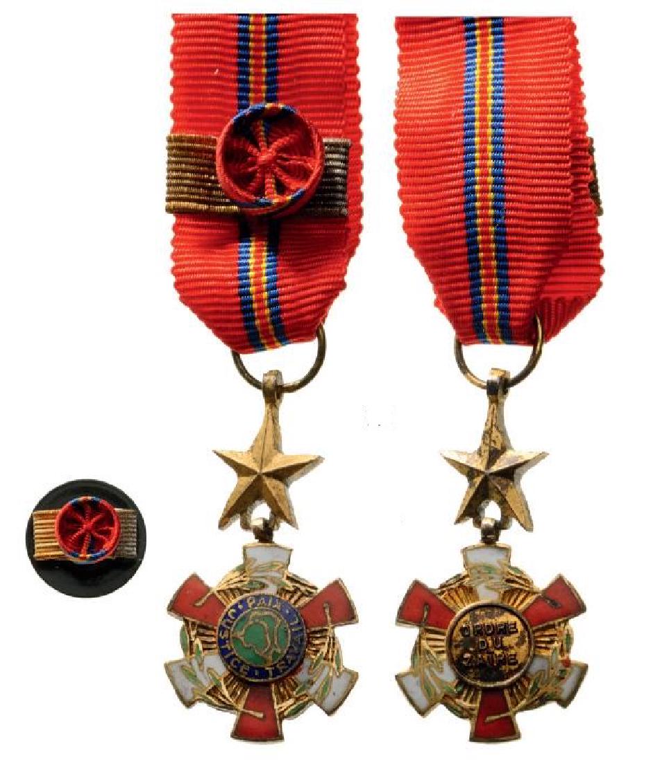 NATIONAL ORDER: ZAIRE, Grand Officer`s Badge Miniature. Breast Badge, gilt Silver, 15 mm, enameled, original suspension ring and ribbon with rosette, with lapel hole rosette. I