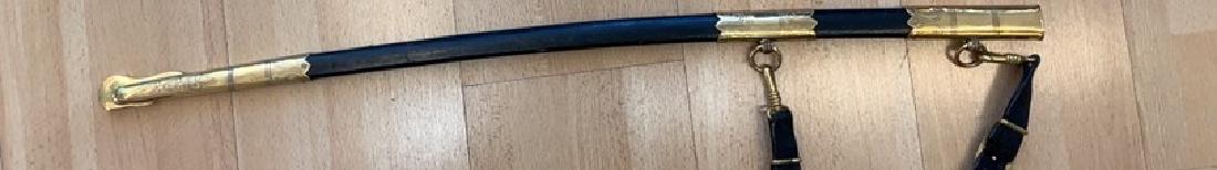 GermanÂ NavyÂ Sword with silver knot and hanger, ww II: GERMANY, Steel engraved blade with floral design, anchors, navy, fine celluloid grip with gold wire, gilt bronzeÂ folting guard with Anchor, black leather scabbard with gilt brassÂ ornaments, gi