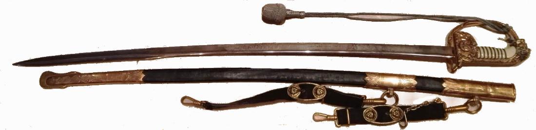 GermanÂ NavyÂ Sword with silver knot- custom, WW II: GERMANY, Steel engraved blade with floral design, anchors, navy, and dedication: â€Erinnerung an die Schleswig-Holstein das offiz. Corpsâ€. Fine celluloid grip with gold wire, gilt bronzeÂ fol