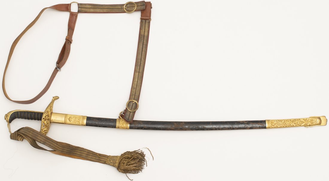 WWI Imperial Austro-Hungarian officer sword with: Steel blade, wire bound Shark Skin grip, very fine ornate gilded guard. Leather scabbard with brass gilded ornaments, with Royal monogram "FJ I" for FRANZ JOSEF THE FIRST" (1867-1915) on the top scabb