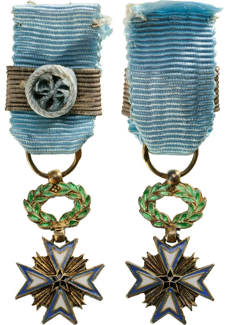 ORDER OF THE BLACK STAR: Commander's Cross Miniature, 3rd Class, instituted in 1889. Breast Badge, 21x12 mm, gilt Silver, hallmarked, both central medallions gilt silver, both sides enameled, original suspension ring and ribb