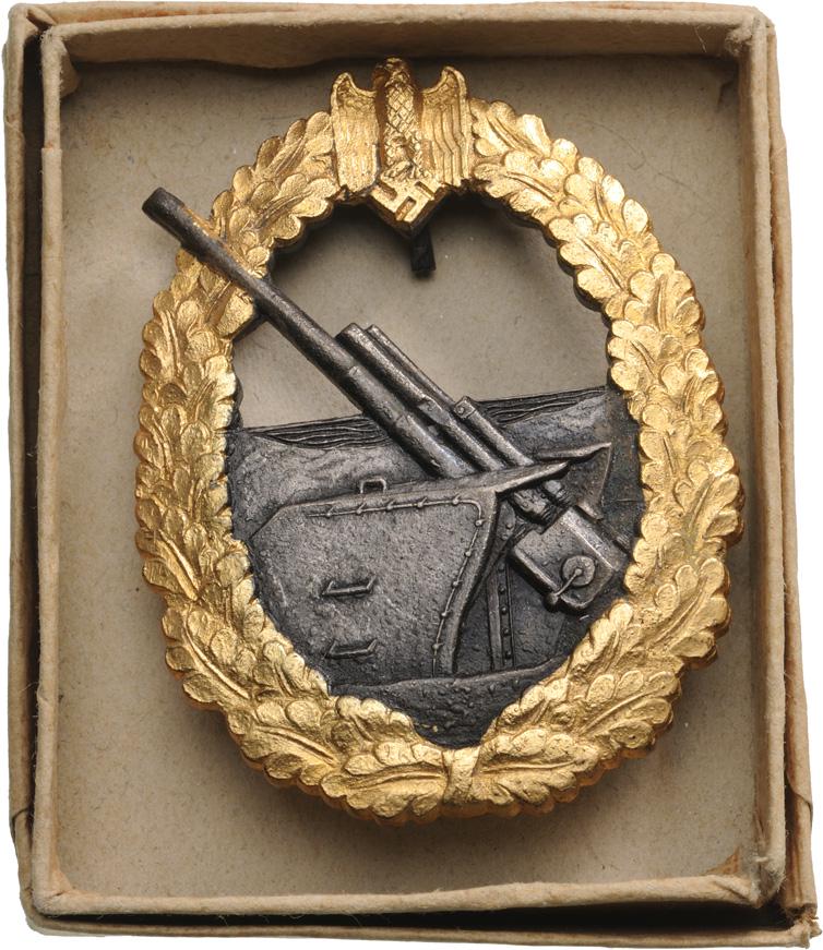 Kriegsmarine Artillery War Badge, instituted in 1941: Breast Badge, 57x43 mm, gilt Zinc, French war time production, horizontal tapered pin on reverse and hook, in original box of issue. I Country: GERMANY- 3RD REICH