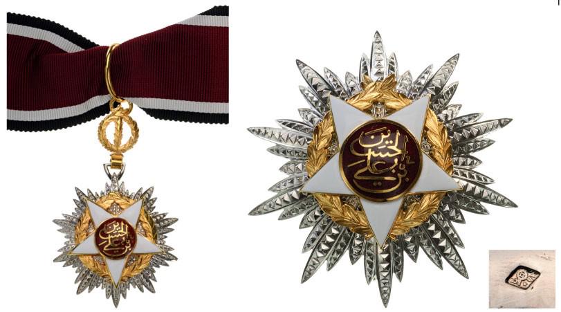 ORDER OF INDEPENDENCE: Grand Officer's Set, 2nd Class, instituted in 1921. Neck Badge, 67x42 mm, silvered Metal, maker's mark "Arthus Bertrand, Paris", central medallion gilt, enameled, original suspension device, ring and 