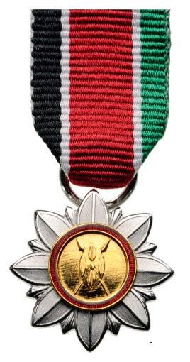 ORDER OF BURNING SPEAR: Breast Badge Miniature, Silver and Silver gilt, 20 mm, maker 's mark "ELM", one side enameled, original suspension ring and ribbon. R! I Country: KENYA