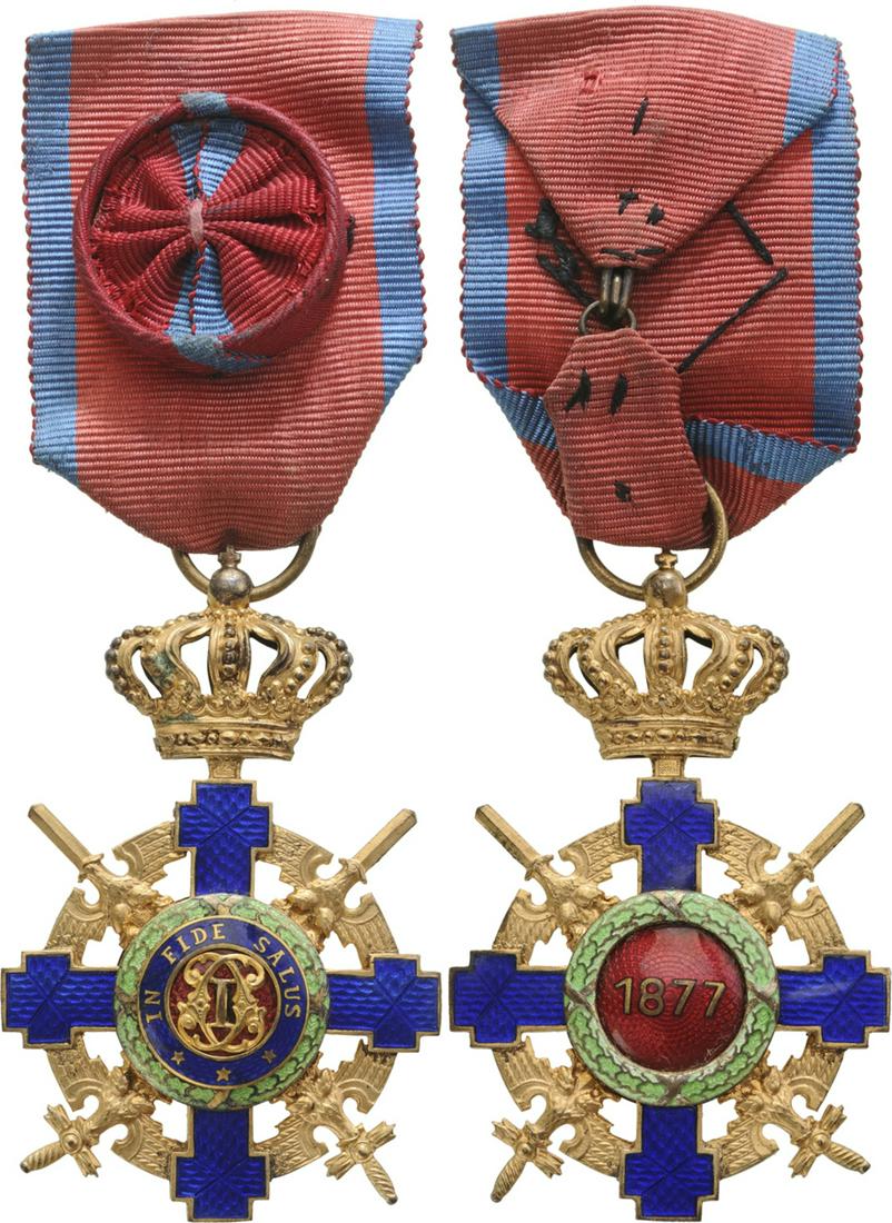 ORDER OF THE STAR OF ROMANIA, 1864: Officer 's Cross, 2nd Model (1932), for Military in Time of War. Breast Badge, 62x40 mm, Bronzel gilt, both sides enameled, original suspension ring and ribbon with rosette. IÂ Country: ROMANIA