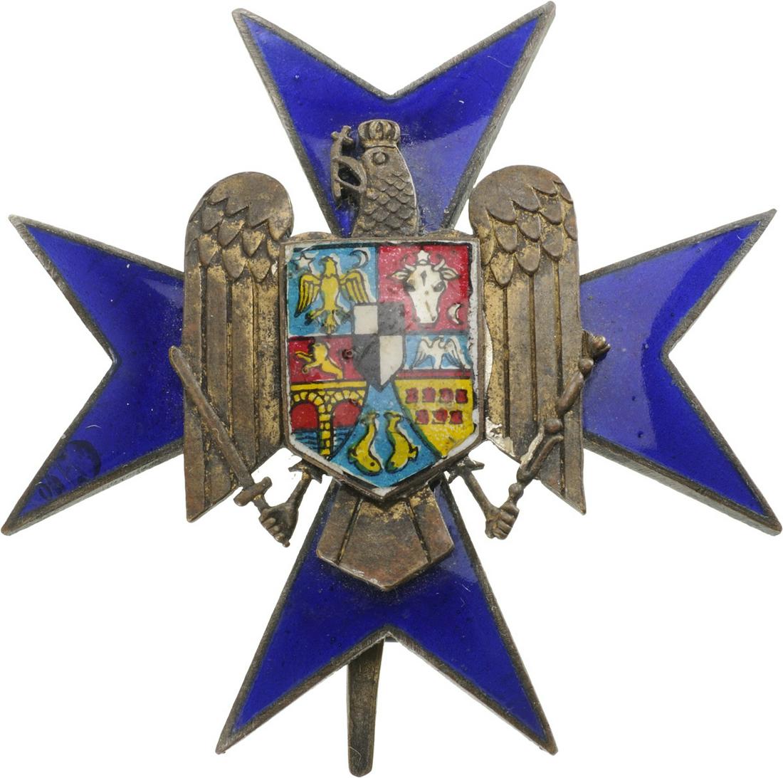 Order of the Civil Guard (1934): 2nd Class. Breast Star, 54,0 mm, Bronze silvered, oneside blue enameled cross with enameled weapon in the centre. Large pin on the back, dark patina. The order was awarded for bravery and devotion in 