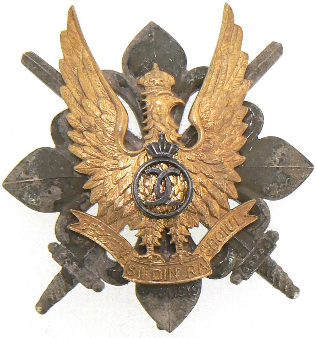WAR BADGE OF THE SCOUTS, 1935 MODEL: 1st Model, King Carol II. Breast Badge, 58x52 mm, partially gilt Silver, maker's mark "CERBU", numbered 199, with pin on reverse, I.M.S.P.R. 756. IÂ Country: ROMANIA