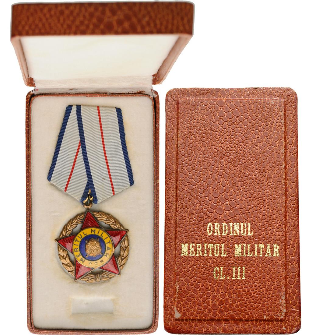 Â RPR - ORDER OF MILITARY MERIT, instituted in 1954: 1st Model, 3rd Class (1954-1965). Breast Badge, Bronze silvered, 39 mm, center enameled, original suspension ring and ribbon, in original case of issue. I- Country: ROMANIA - POPULAR REPUBLIC, 1948-19
