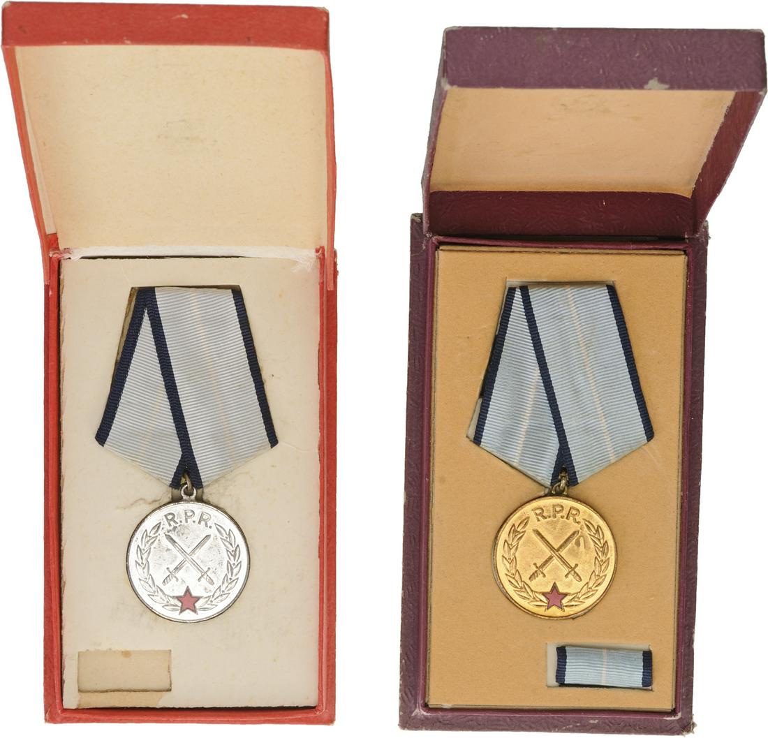 RPR - MEDAL OF MILITARY MERIT, 1954-1965: 1st Model, Set 1-2 Classes. Breast Badges, 36 mm, Bronze gilt and silvered, original suspension rings and ribbons, one with riboon bar, in cases of issue with gilt inscription on the lid. (2) I Countr