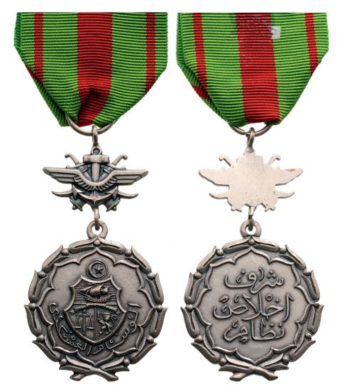 MILITARY MERIT MEDAL: Breast Badge, 55x33 mm, original suspension device and ribbon. Scarce! R! I Country: TUNISIA
