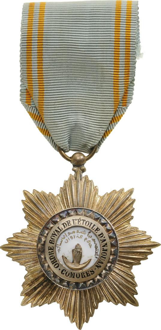 ROYAL ORDER OF THE STAR OF ANJOUAN: Knight's Cross, 5th Class, instituted in 1874. Breast Badge, 51 mm, gilt Silver, central medallion enameled, original suspension ring and ribbon. I Country: COMOROS ISLANDS
