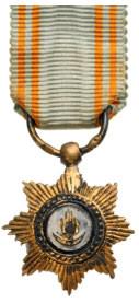 ROYAL ORDER OF THE STAR OF ANJOUAN: Knight's Cross Miniature, 5th Class, instituted in 1874. Breast Badge, 17x14 mm, gilt Bronze, central medallion enameled, original suspension ring and ribbon. I Country: COMOROS ISLANDS