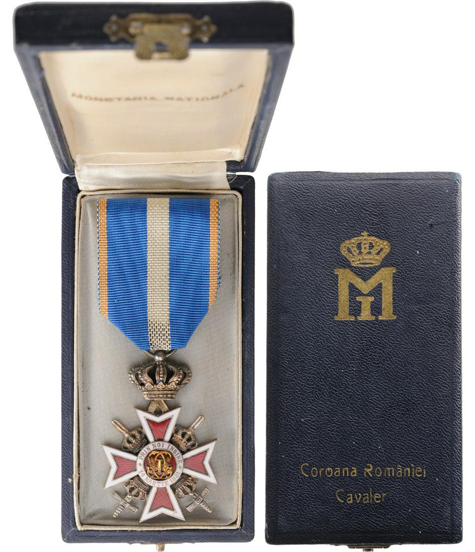 ORDER OF THE CROWN OF ROMANIA, 1881: Knight 's Cross, 2nd Model, Military in Time of War. Breast Badge, 56x37 mm, silvered, both sides enameled, original ring and ribbon, in original case of issue with Cypher of King Mihai I on the lid. 