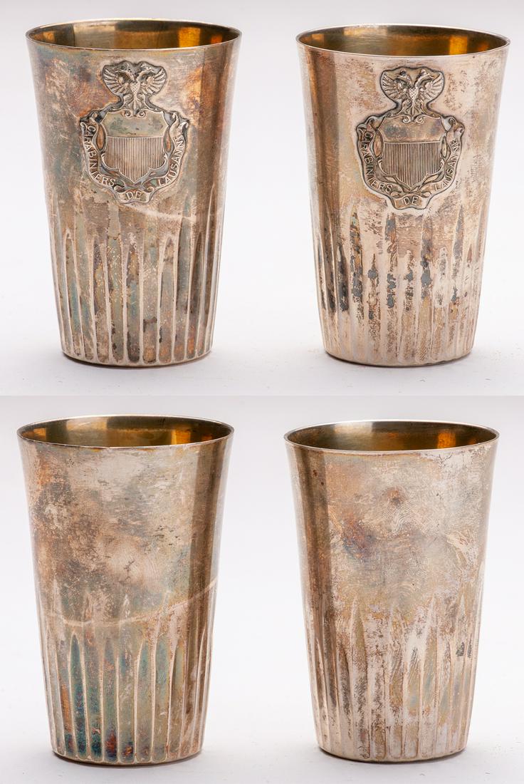 Pair of silver tumblers: Pair of silver tumblers, conical fluted pattern, engraving celebration of the "Carabiniers de Lausanne" guarantee 800, Swiss punches. Work circa 1920. Height 8.5 cm, weight 60 and 58 g. Good condition