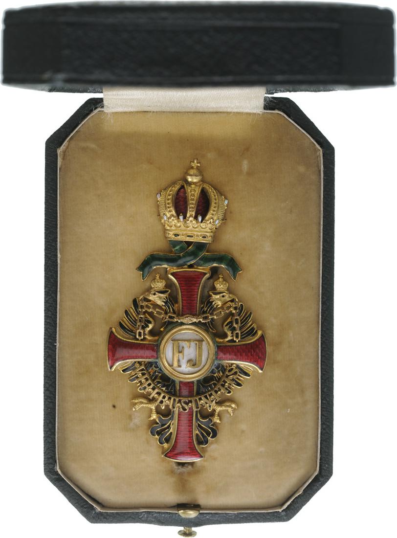 ORDER OF FRANZ JOSEPH: Officer's Cross with War Decoration, 2nd Type, 2nd Period, 4th Class, instituted in 1849. Breast Badge, 75x40 mm, gilt Bronze, obverse enameled, hallmarked "star", maker's mark "Mayer's Sohne,Â&#