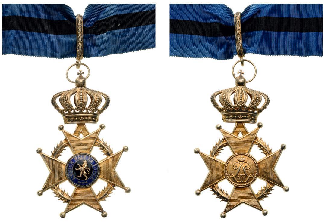 ORDER OF LEOPOLD II: Commander`s Cross, 3rd Class, instituted in 1900. Neck Badge, gilt Silver, 50 mm, both central medallions gilt silver, obverse enameled, original suspension loop and neck ribbon. I Country: BELGIUM