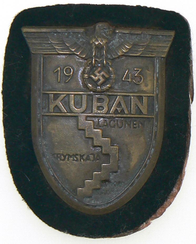 Kuban Shield Badge: Bronzed zinc, 50 x60 mm, on black cloth backing. I - Country: GERMANY - 3RD REICH