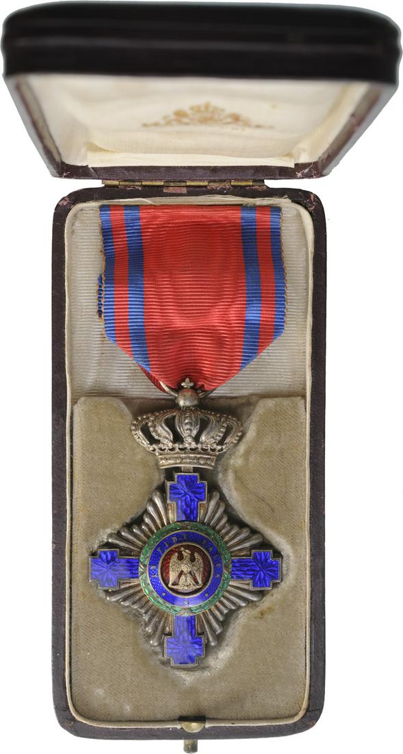 ORDER OF THE STAR OF ROMANIA, 1864: Knight 's Cross, 1st Model, for Civil. Breast Badge, 63x43 mm, Silver, maker's mark "2 dolphins - Resch", both sides red enameled, obverse medallion with cipher of Carol I, reverse medallion with "10