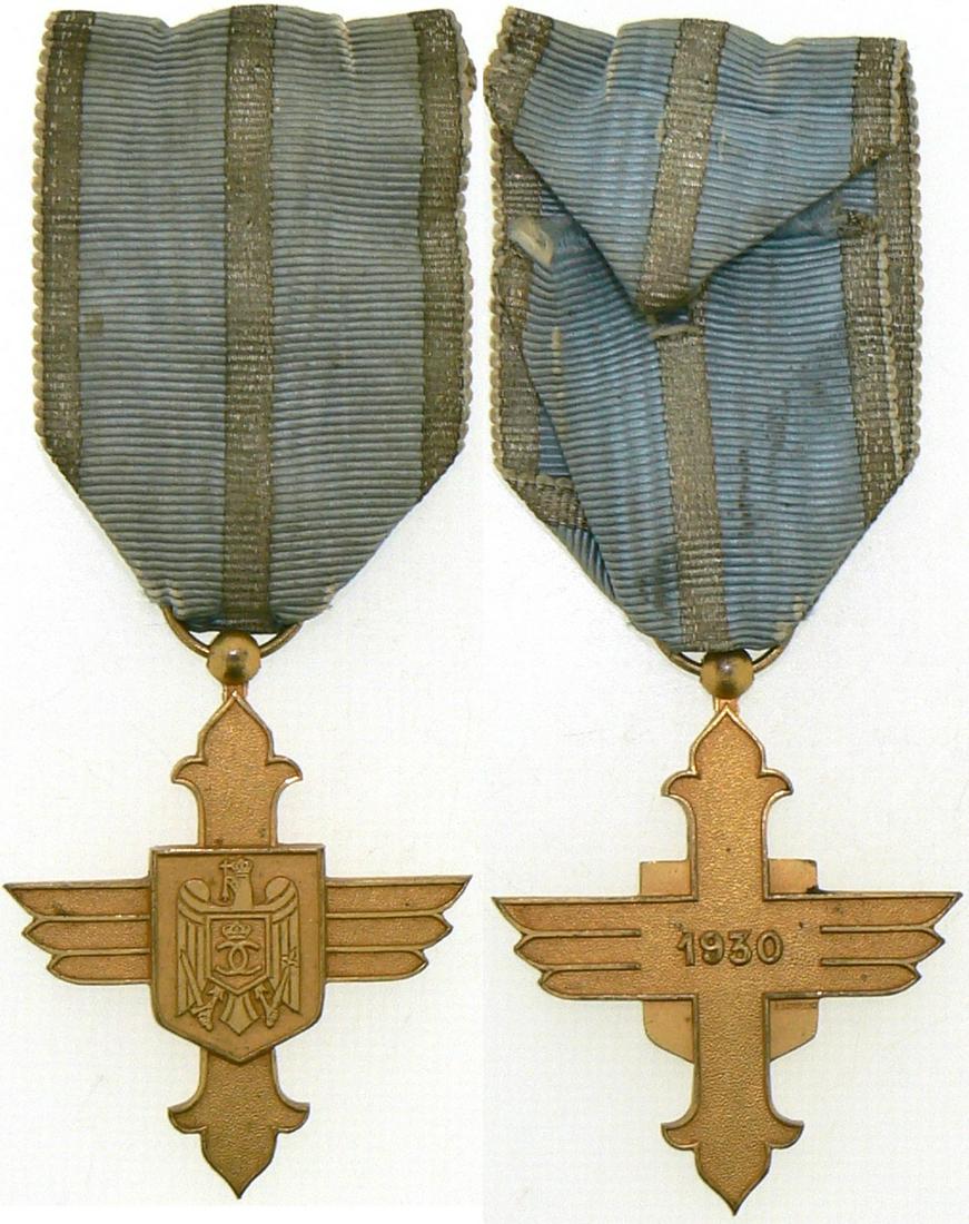 ORDER OF THE AERONAUTICAL VIRTUE, 1930: Gold Cross, 1st Model with cipher of King Carol II, for Civil, 1940. Breast Badge, 50x43 mm, gilt Bronze, signed "A. Lavillier", original suspension ring and ribbon. Mint state! I Country: ROMANIA