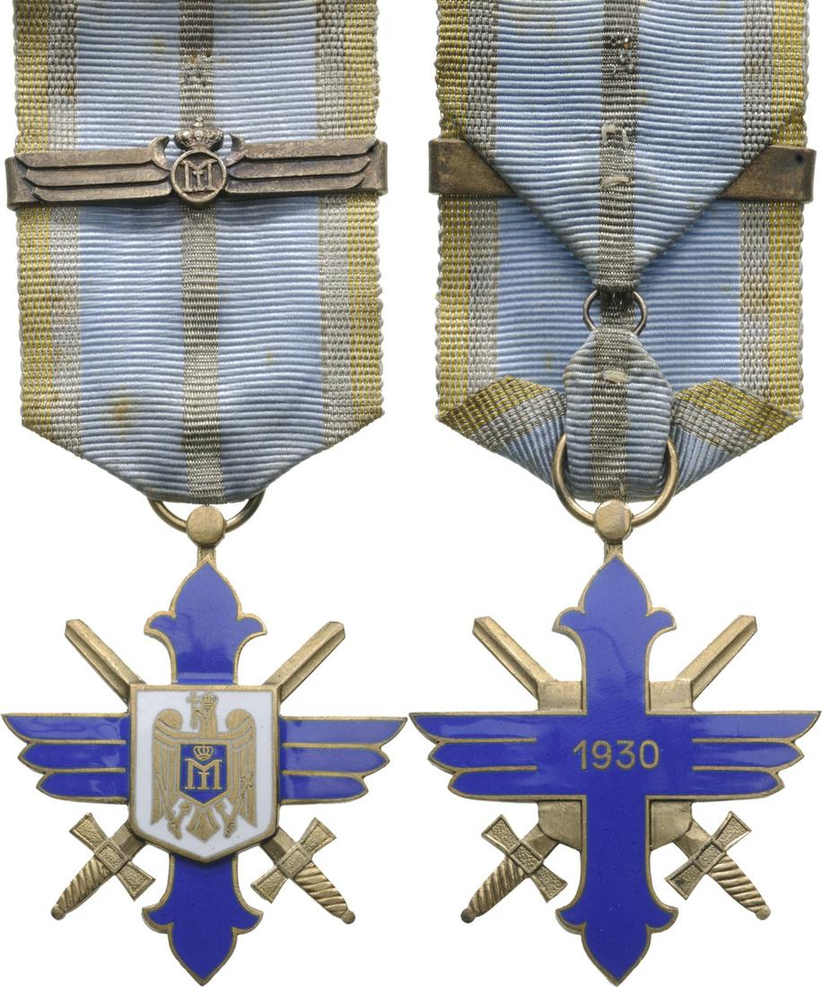ORDER OF THE AERONAUTICAL VIRTUE, 1930: Knight`s Cross, 2nd Model, for Military. Breast Badge, 50x42 mm, gilt Bronze, original suspension ring, ribbon and bar with King Carol II monogram. Extremely fine quality and condition! Scarce! I R! C