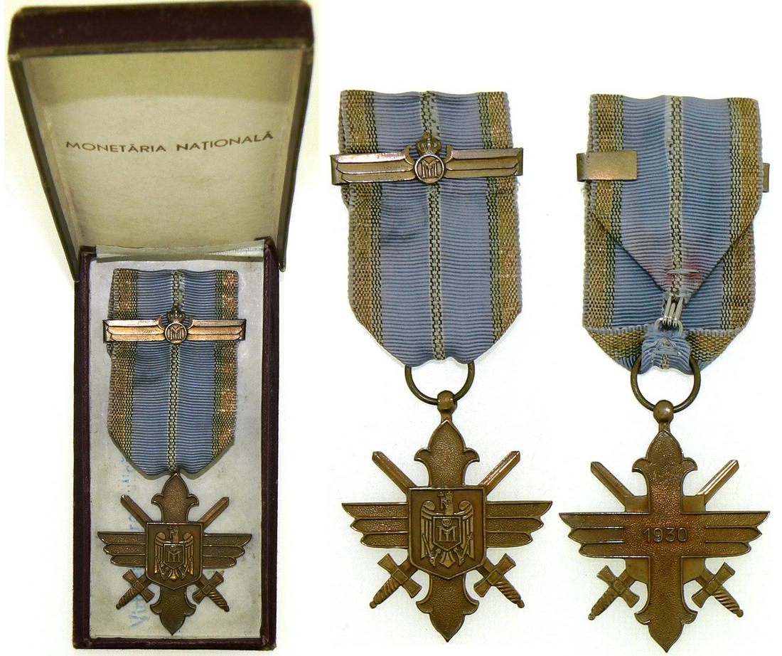 ORDER OF THE AERONAUTICAL VIRTUE, 1930: Gold Cross, 2nd Model with cipher of Michael I, for Military, 1940. Breast Badge, 50x43 mm, gilt Bronze, original suspension ring, ribbon and bar with King Michael monogram, in original case of issue 