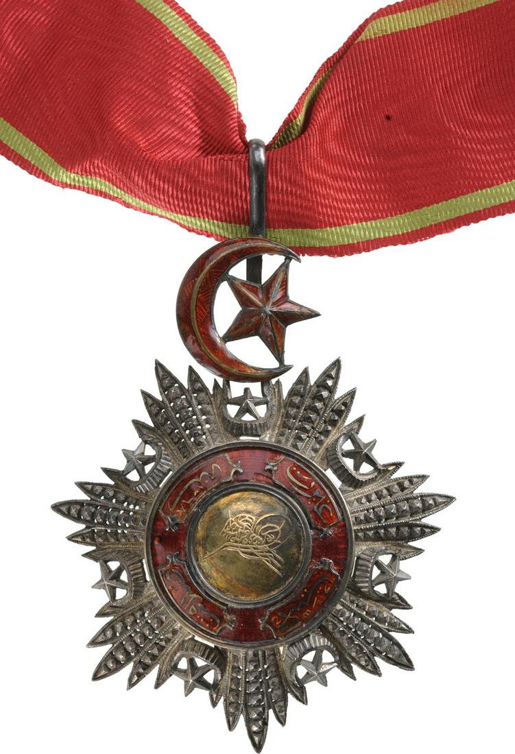ORDER OF MEJIDIE: Commander's Cross, 3rd Class, instituted in 1852. Neck Badge, 76x61 mm, GOLD and Silver with brilliant cut rays, central medallion GOLD, enameled, original suspension device and neck ribbon. Superb! I