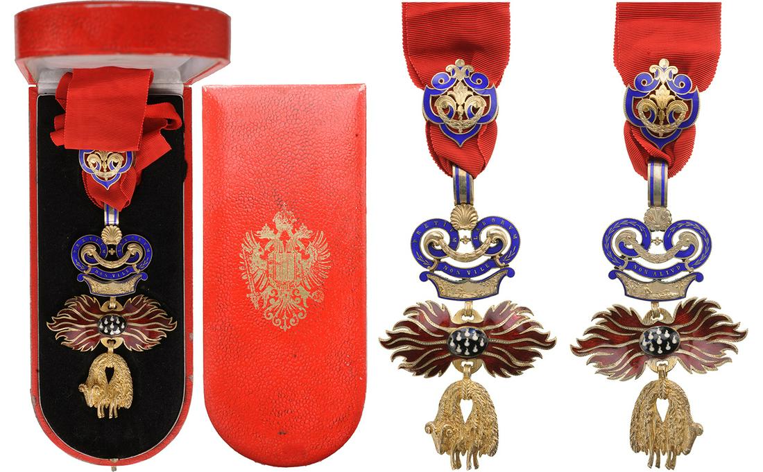 Order of the Golden Fleece: Neck Decoration of the order, 120x69 mm., in gilt Silver; the Fleece, chiseled and engraved, black and white enameled " flint" with red emailed " flames", convex to the obverse, concave to the reverse