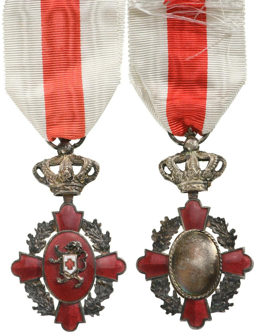 Military Donneurs of Blood Medal: Silver Class. Breast Badge, 65x37 mm, silvered Metal, both central medallions silvered, both sides enameled, original suspension ring and ribbon.I- Country: BELGIUM