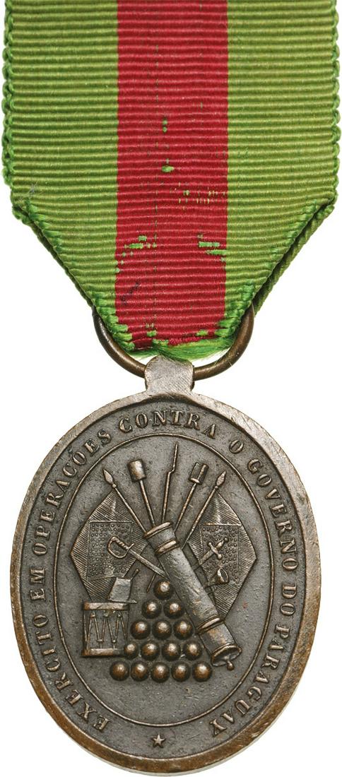 Medal for Military Valor, instituted in 1868: Breast Badge, 35x26 mm, Bronze, obverse depicting a trophy of arms and flags, legend "EXERTICO EM OPERACOES CONTRA O GOVERNO DO PARAGUAY" on the back in the center "RECOMPENSA A BRAVURA MILITAR" in a 