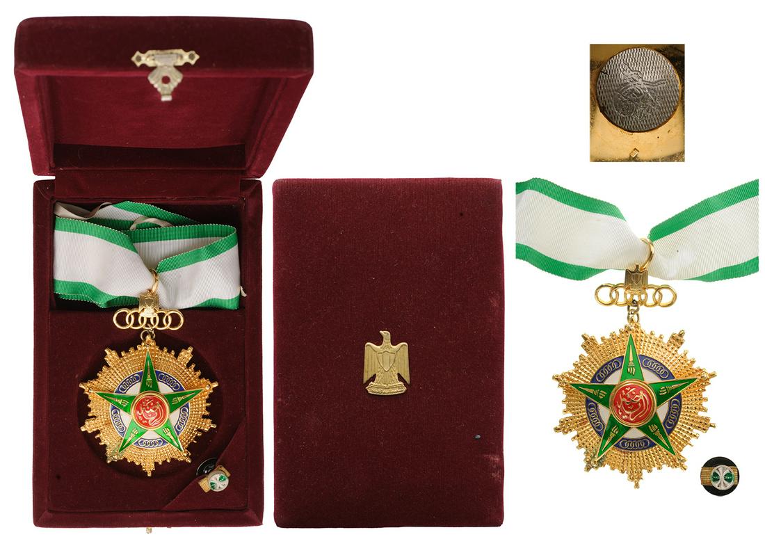 Order of Sporting Merit: Commander's Cross, 1st Class. Neck Badge, 93x70 mm, gilt Copper, enameled, original suspension device with Egyptian coat of arms, in original case of issue with golden weapon on the lid. Extremely fin