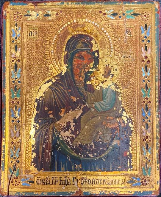 Old Icon of Virgin Carrying the Infant Jesus: Old icon with the effigy of traditional Virgin of tenderness carrying the infant Jesus, representation on the model of the Virgin Hodegetria (icon of Volhynia) in Ukraine. Beautiful polychrome enamel 