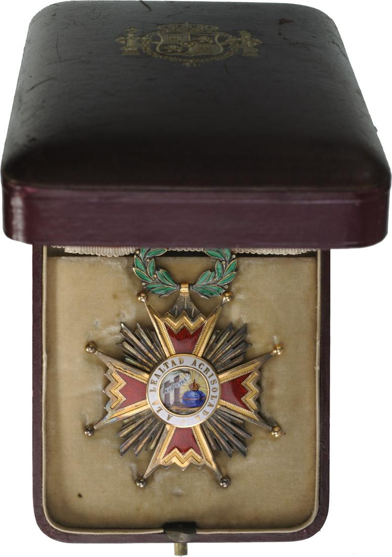 ORDER OF ISABELLA THE CATHOLIC: Commander`s Cross, 3rd Class, instituted in 1815. Neck Badge, gilt Silver, 75x55 mm, superimposed parts gilt enameled, both central medallions gilt, enameled, original suspension wreath, loop and ribb