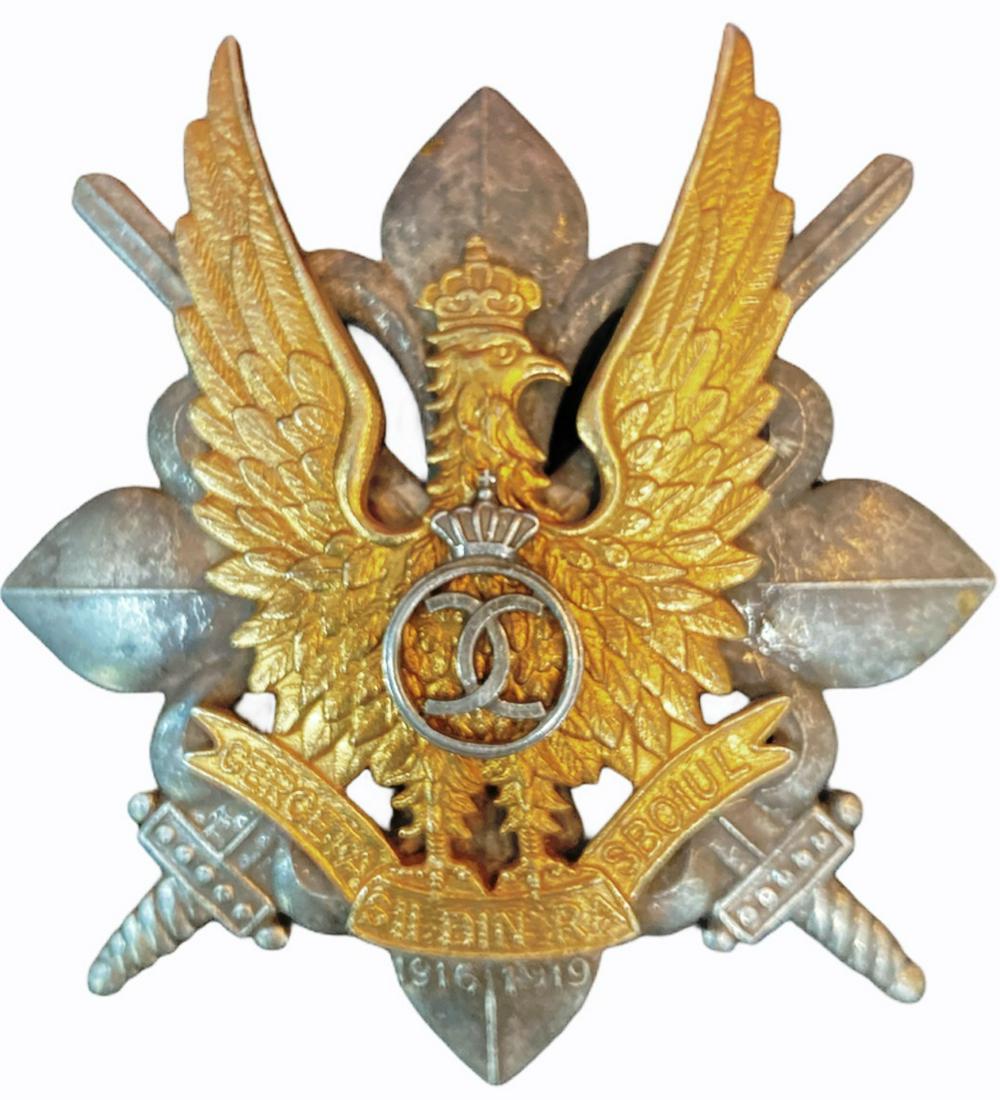 WAR BADGE OF THE SCOUTS, 1935 MODEL: 1st Model, King Carol II. Breast Badge, 58x52 mm, partially gilt Silver, maker's mark "CERBU", numbered 7, with pin on reverse, I.M.S.P.R. 756. Very rare low number! I RR!