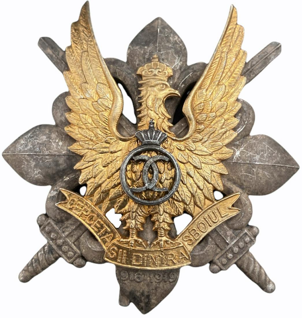 WAR BADGE OF THE SCOUTS, 1935 MODEL: 1st Model, King Carol II. Breast Badge, 58x52 mm, partially gilt Silver, make's mark "CERBU", numbered 185, with pin on reverse, I.M.S.P.R. 756. I