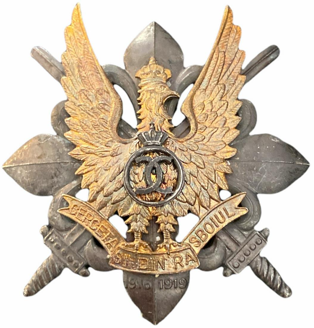 WAR BADGE OF THE SCOUTS, 1935 MODEL: 1st Model, King Carol II. Breast Badge, 58x52 mm, partially gilt Silver, make's mark "CERBU", numbered 210, with pin on reverse, I.M.S.P.R. 756. I