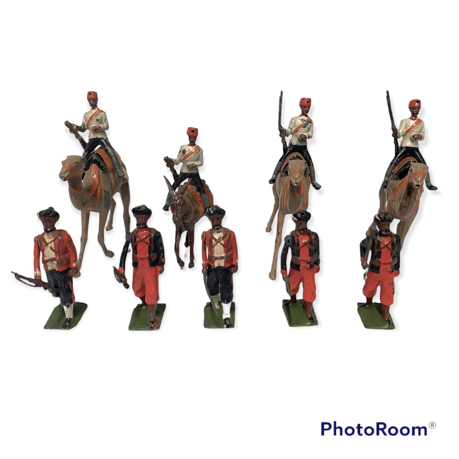 Set of 9 Lead Toy Soldiers representing Cavalry and: Set of 9 Lead toy soldiers, five on foot, three on camel back and one on a mule. Painted. Fair to good condition.