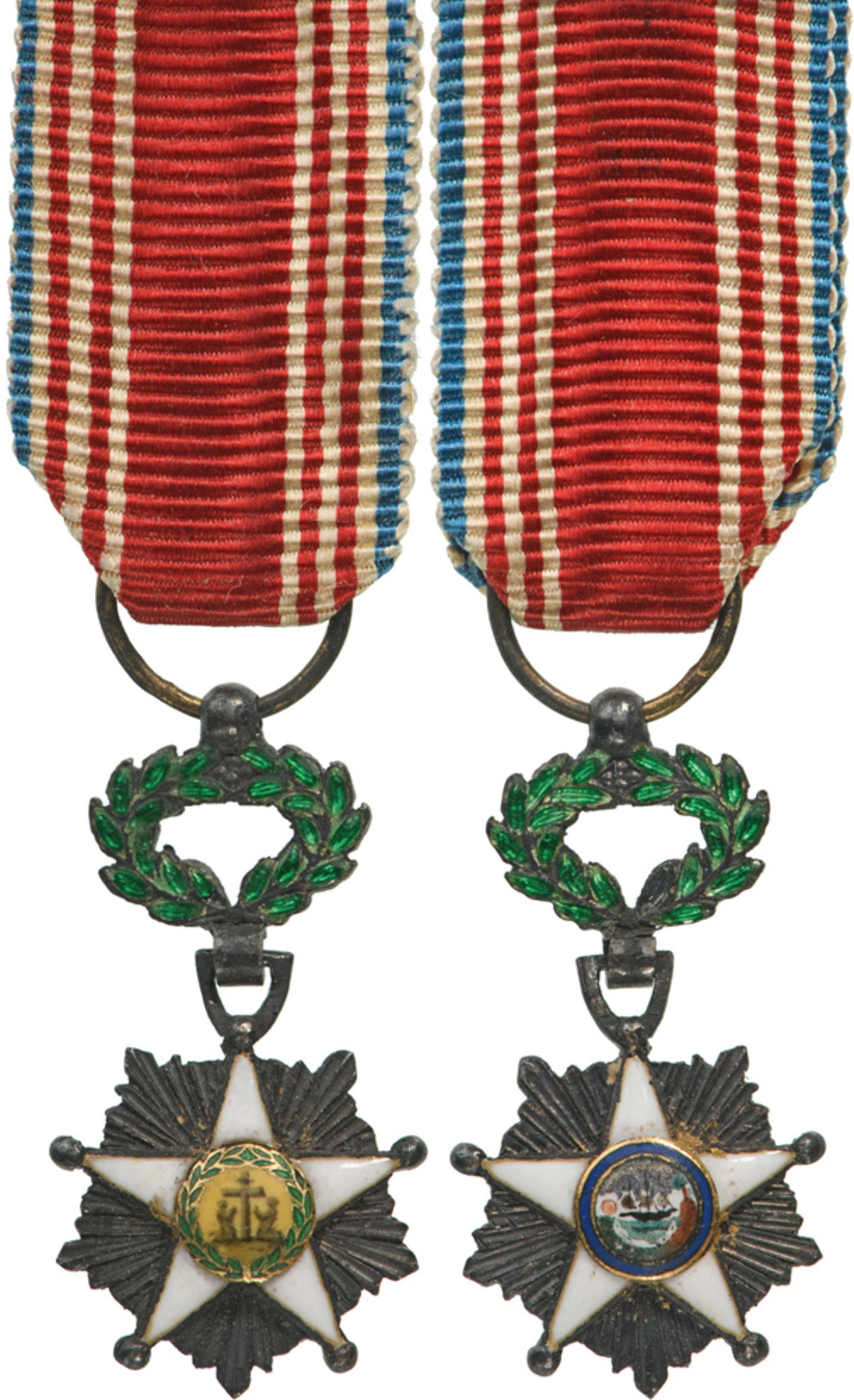 Order of African Redemption: Knight's Cross Miniature, 5th Class, instituted in 1879. Breast Badge, 23x12 mm, Silver, central medallion GOLD, enameled, original suspension wreath, ring and ribbon. A splendid and rare miniature of