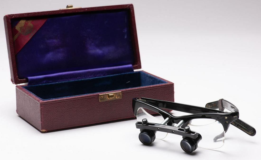 Pair of ophthalmologist telescopic eyeglasses: Pair of ophthalmologist telescopic eyeglasses for visual tests. Swiss made Ramstein in Basel, re-commercialized in England by Keller. Circa 1960. In the original box. Good condition.