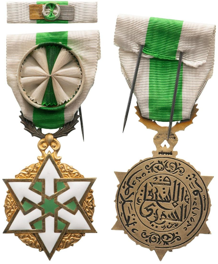ORDER OF THE CIVIL MERIT: Officer's Cross, instituted in 1953. Breast Badge, 62x39 mm, gilt Bronze, one-side enameled, Arab inscription on reverse, original suspension device, ribbon with rosette and lapel bar. Superb conditio