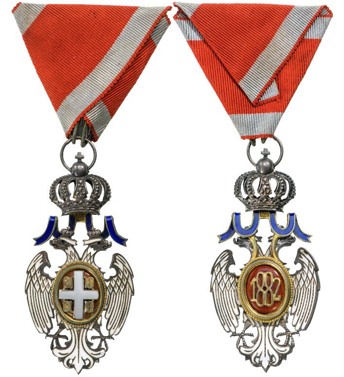 Order of the White Eagle, 1883: Knight's Cross, 5th Class, 2nd Type. Breast Badge, Silver, 69x34 mm, both sides enameled, original suspension ring and triangular ribbon. An elegant badge, in extremely fine condition! I