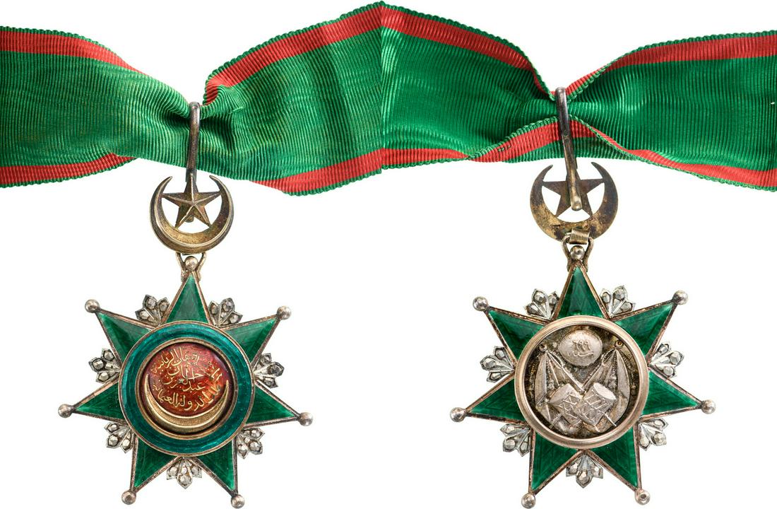 ORDER OF OSMANI: Commander's Cross, 3rd Class. 3rd Class, instituted in 1852. Neck Badge, 81x62 mm, Silver, superimposed parts enameled, original suspension crescent, ring, loop and ribbon.A superb badge in best condi