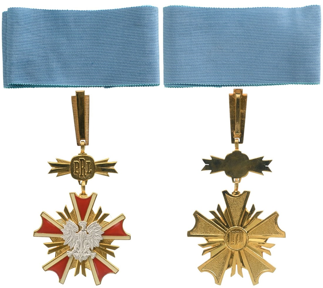 ORDER OF MERIT: Commander`s Cross, instituted in 1974. Neck Badge, 89x60 mm., gilt Bronze, original suspension device, loop, and neck ribbon, in case of issue, with gilt weapon on the lid. Superb jeweler`s quality in