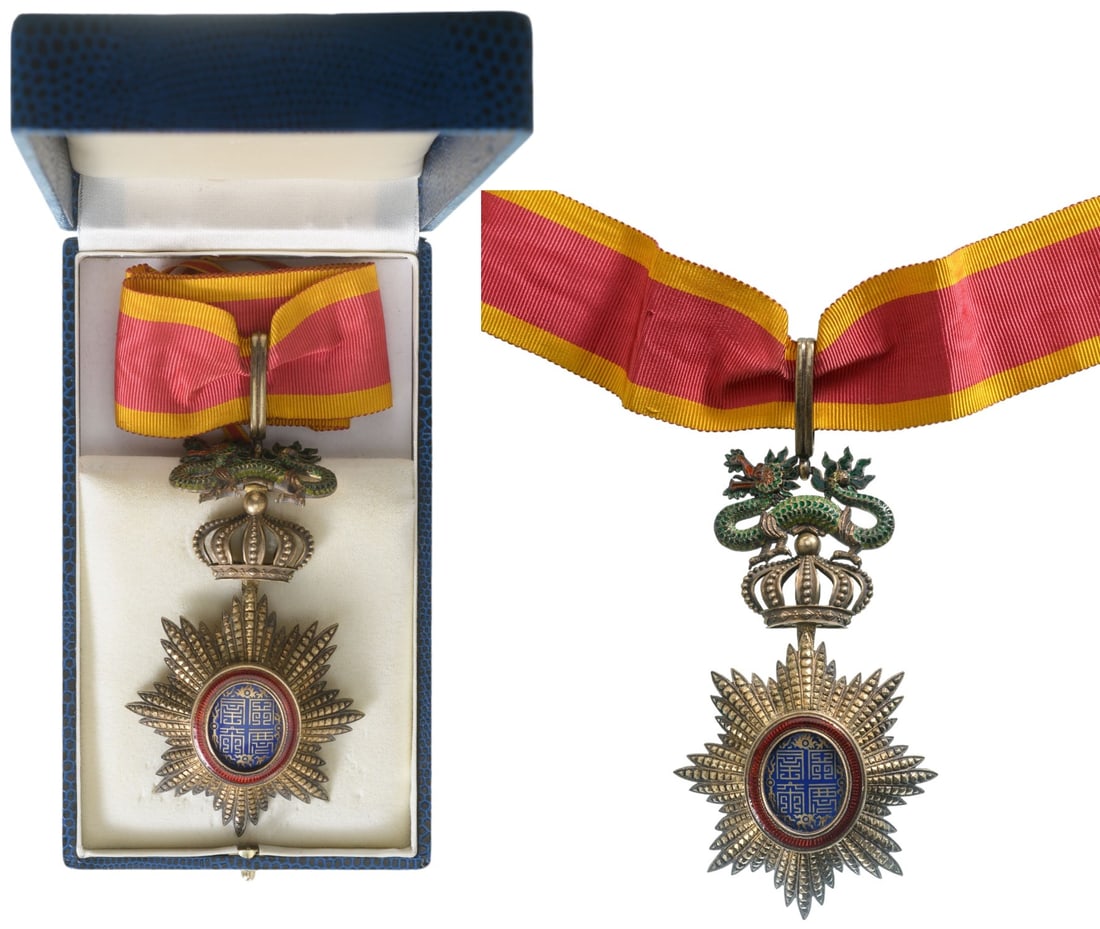 ORDER OF THE DRAGON OF ANNAM: Commander`s Cross, 3rd Class, instituted in 1886. Neck Badge, 117x70 mm., gilt Silver, hallmarked, French maker's mark "A.C.", brilliant cut rays, central medallion enameled, original suspension devic