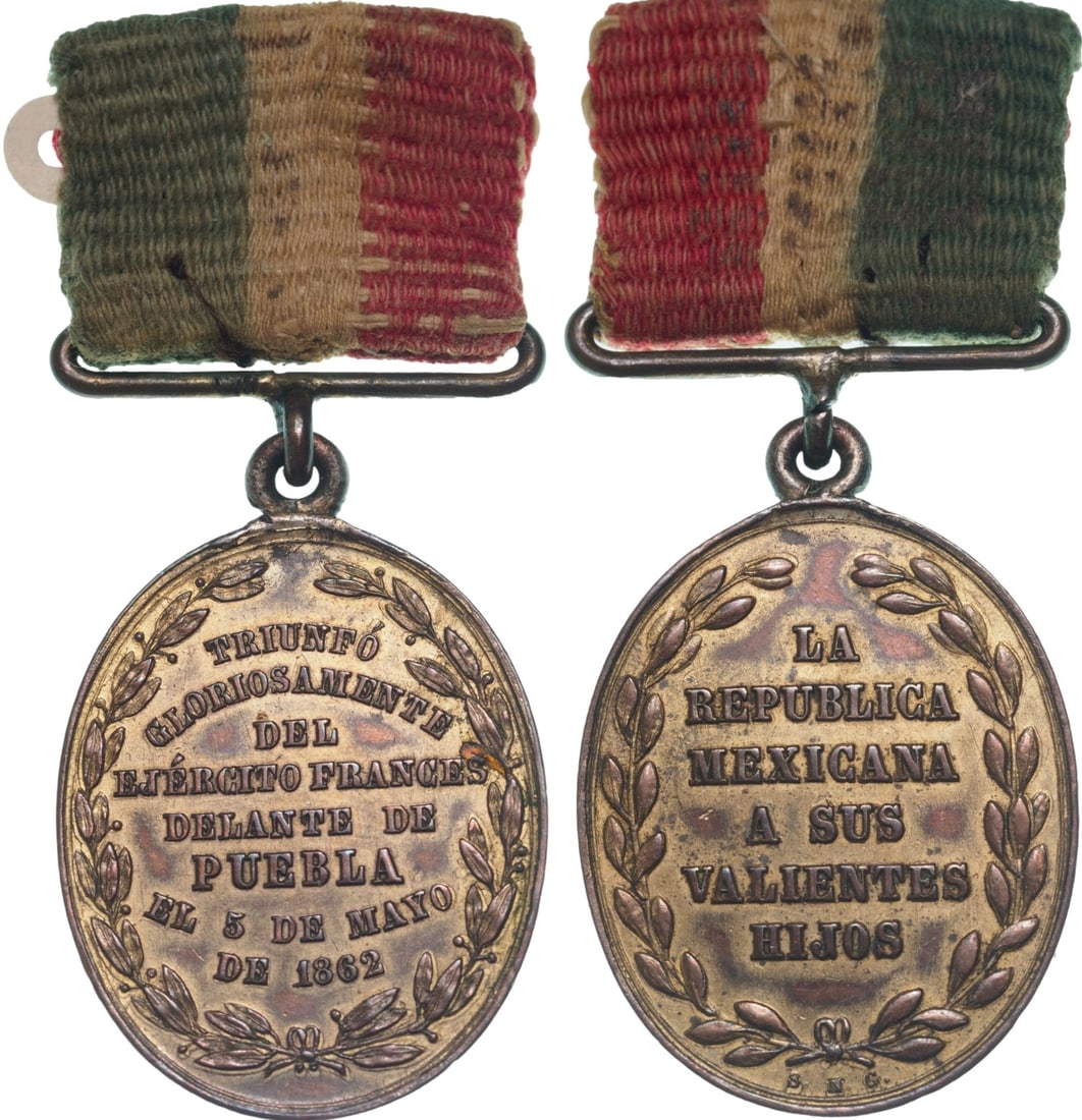 Commemortive Medal of the Battle of Puebla, 1862: Breast Badge, 31x21 mm., gilt Bronze, original suspension ring and short ribbon. Rare! I R!