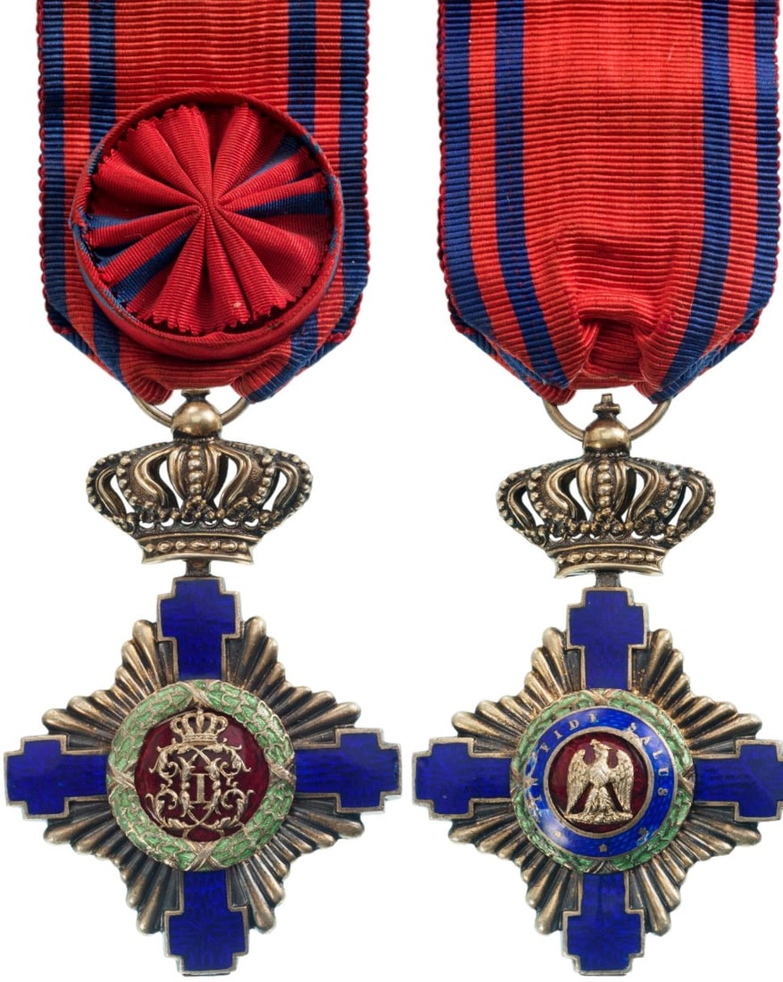 ORDER OF THE STAR OF ROMANIA: Officer 's Cross, 1st Model, for Civil. Breast Badge, 65x43 mm, gilt Silver, both sides red enameled, obverse medallion with cipher of Carol I, reverse medallion with "10 Maiu", original suspension ri
