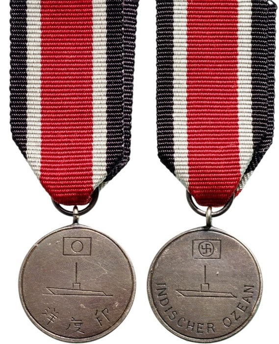 Yanagi Mission Submarine Medal: Breast Badge, 15 mm., Silver, original suspension ring and ribbon. A very rare and interesting miniature, awarded to the survivors of the Yanagi submarine missions, Japanese marines sailing to Germany
